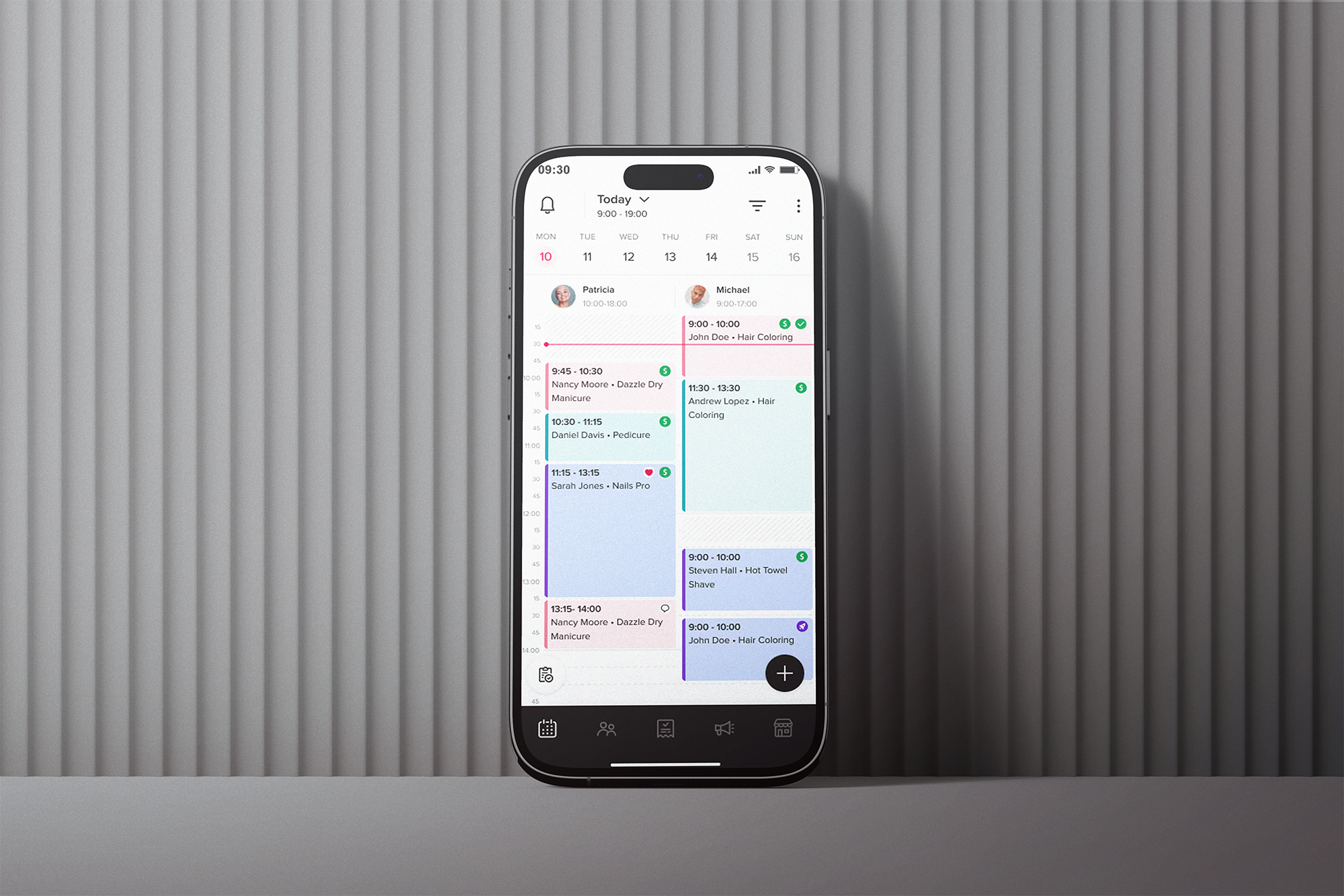Smartphone with Booksy app on.
