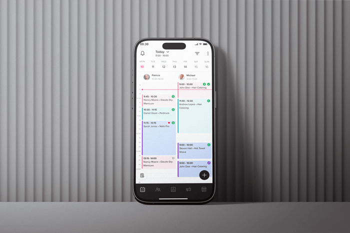 Smartphone with Booksy app on.