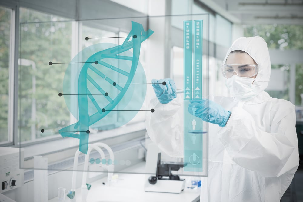 Chemist working cautiously with blue liquid and futuristic interface with dna diagram on it.