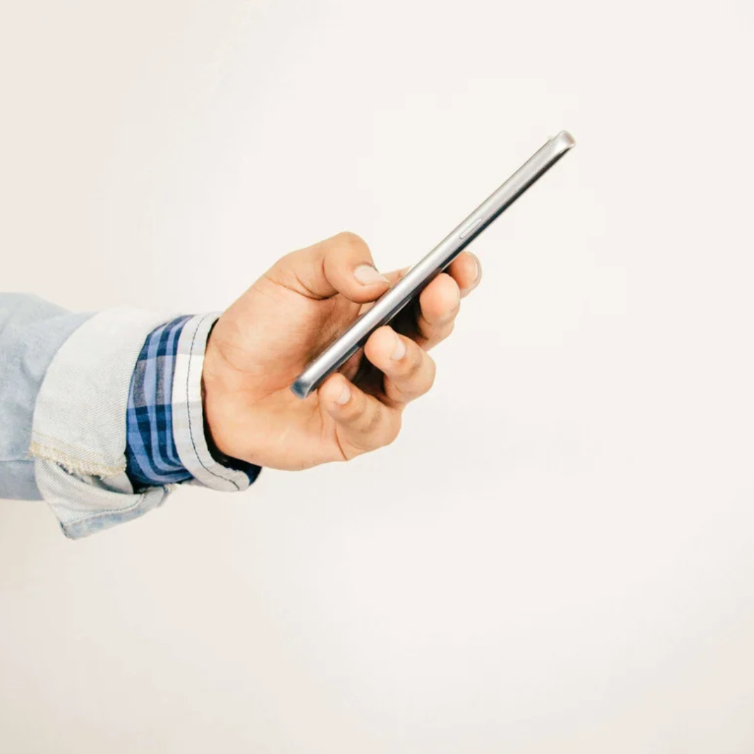 hand holding a smartphone (side-view)
