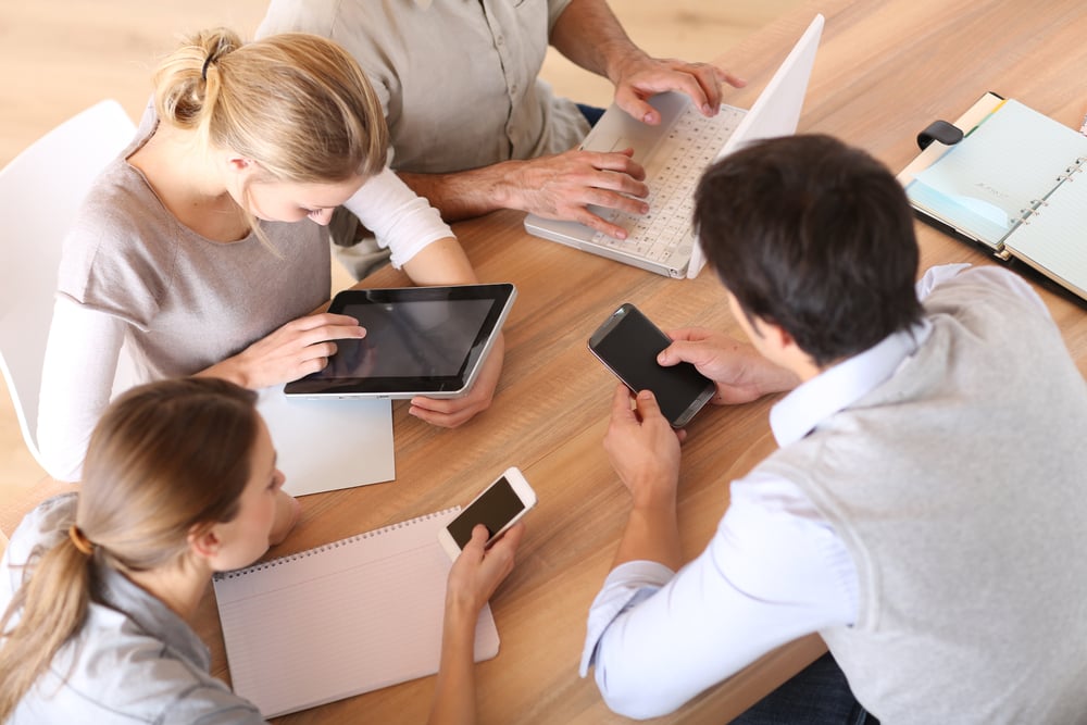Group of business people using electronic devices: Natural Language Search