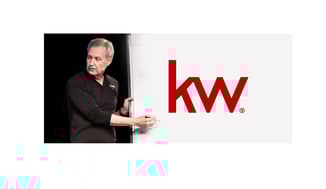 A man standing next to a whiteboard