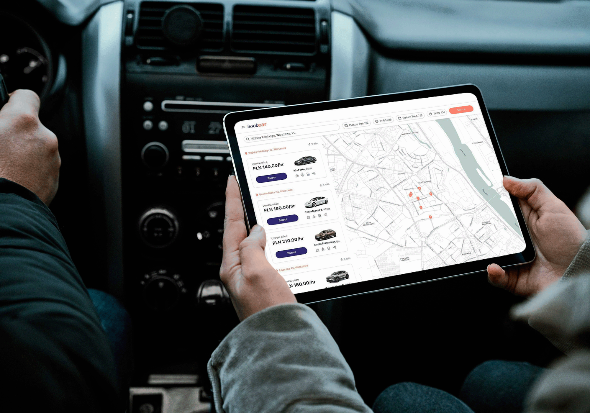 A person holding an ipad with a car marketplace site on.