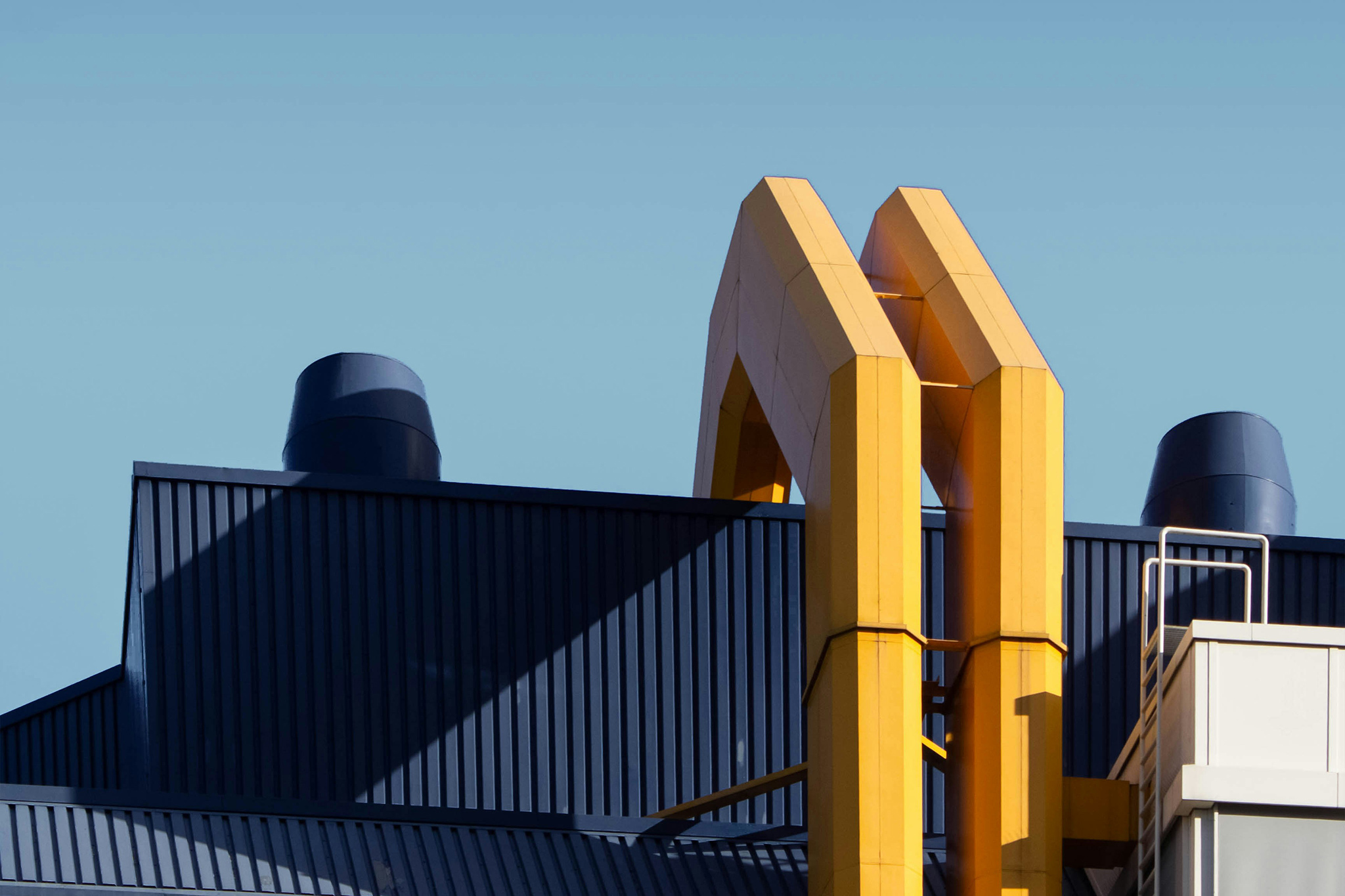 Yellow heating pipes on a rooftop.