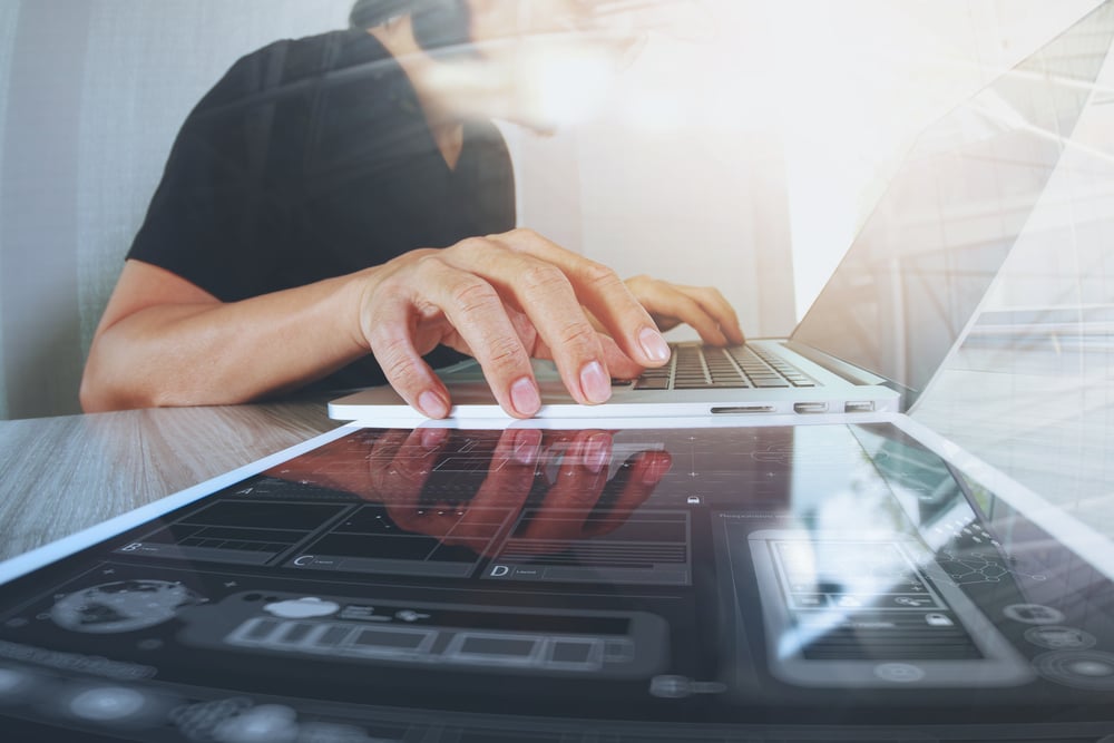 Website designer working digital tablet and computer laptop with smart phone and digital design diagram on wooden desk as concept-2