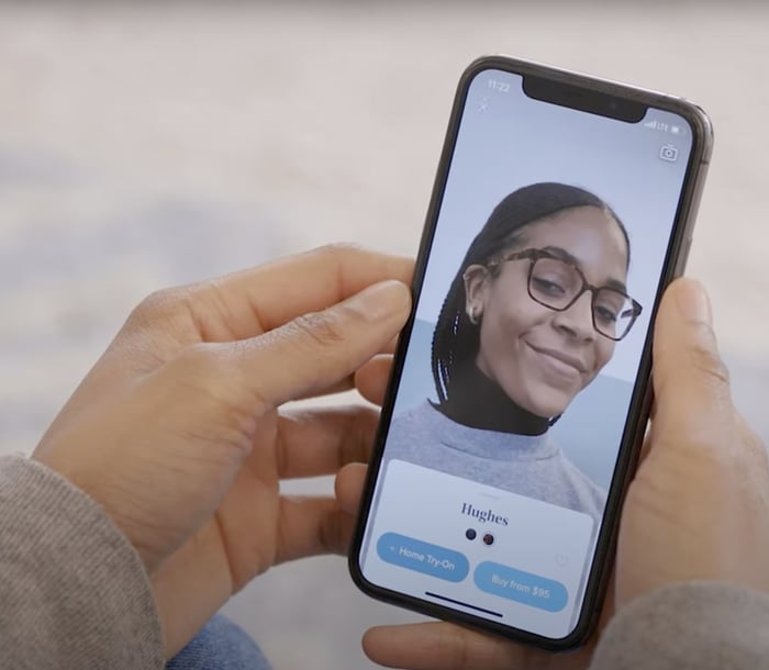 person using a virtual try-on app feature