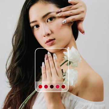 Woman showing nails inside the abstract frame with the color picker, demonstrating the concept of the Cosmo app.