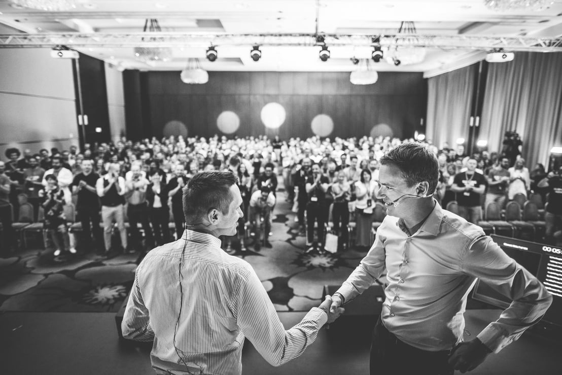 Two men are shaking hands to agree on a cooperation