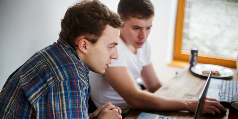 men working on a computer