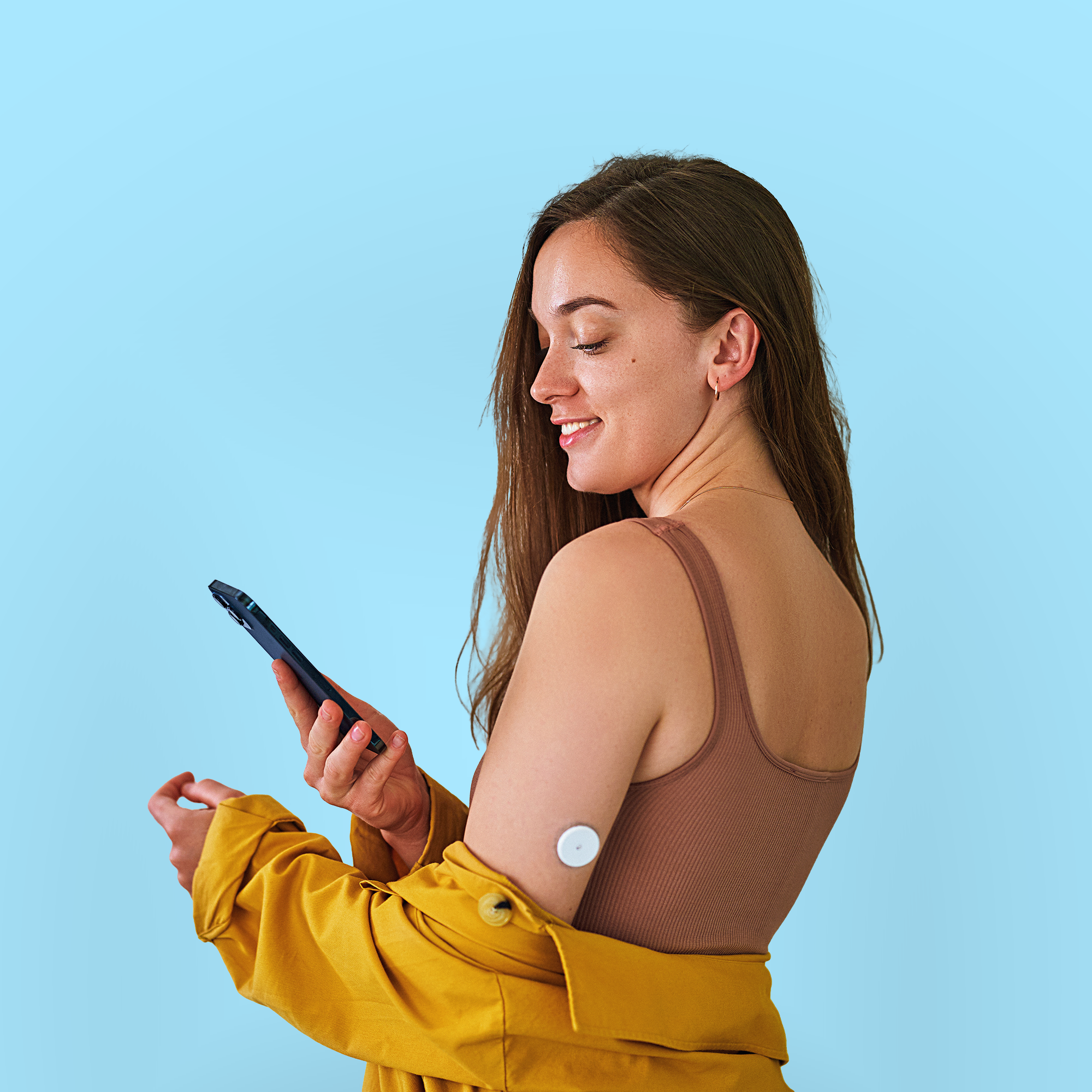 Girl with a smart device monitoring health.
