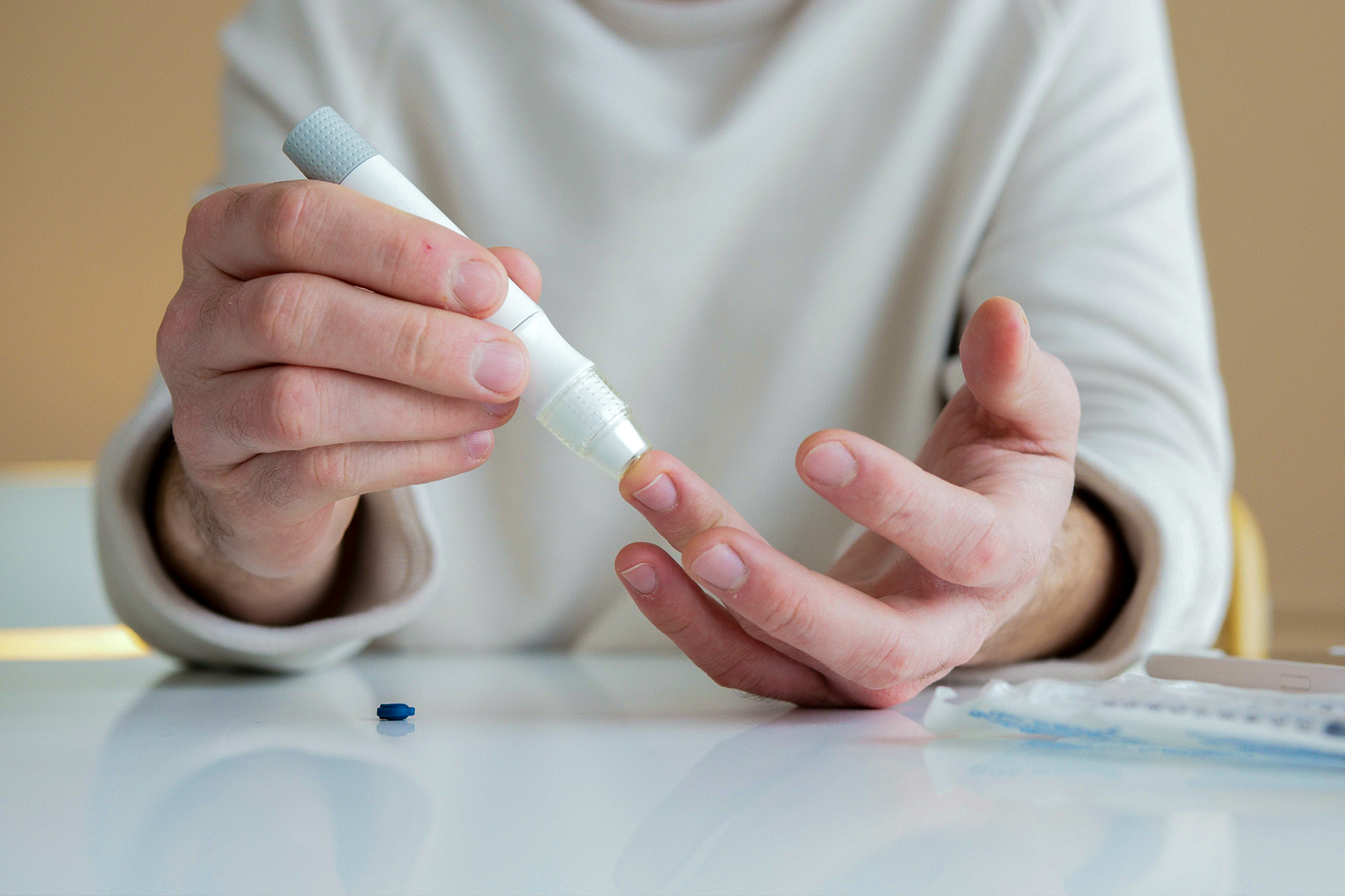 Man with a glucose monitoring device.
