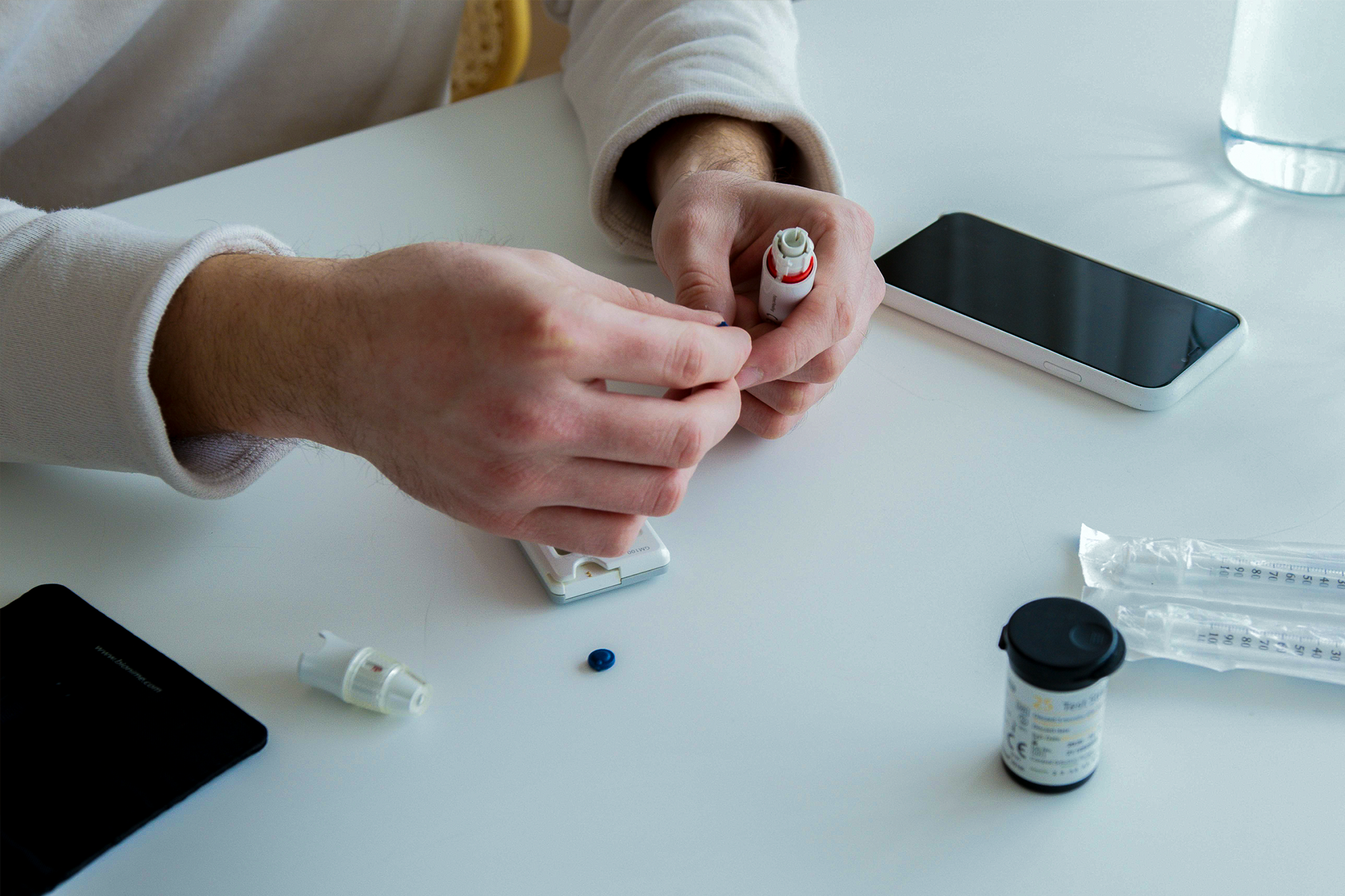 Person doing self-testing with the help of smart devices.