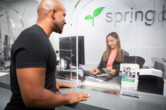 a customer at Spring Bank counter